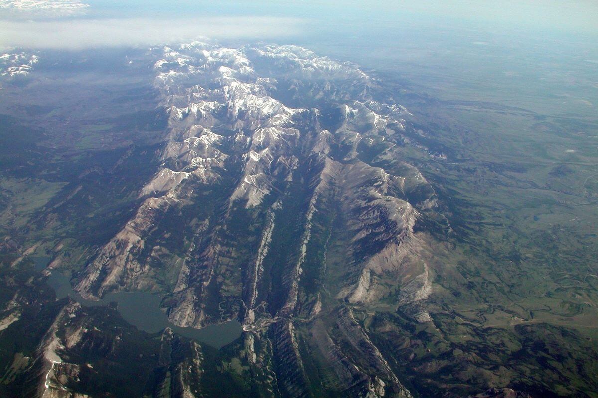 An aerial view of a mountain range in Sun River Canyon and Gibson Reservoir, among the best places to see Montana bighorn sheep.