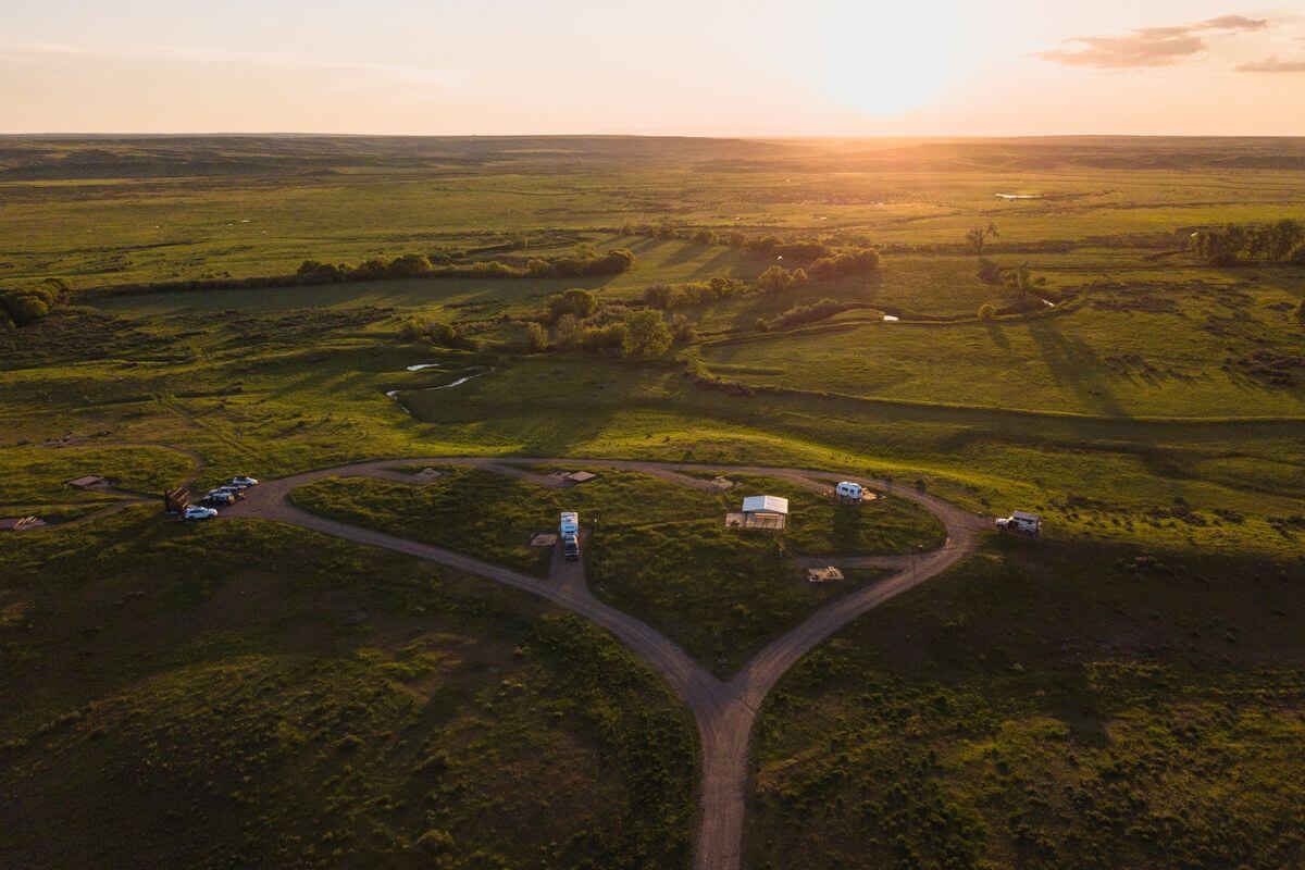 Aerial view of a rural landscape during sunset in the American Prairie Reserve, Montana.