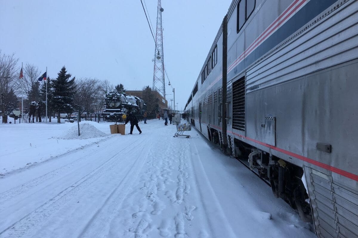 A passenger train on a snowy track in Montana.