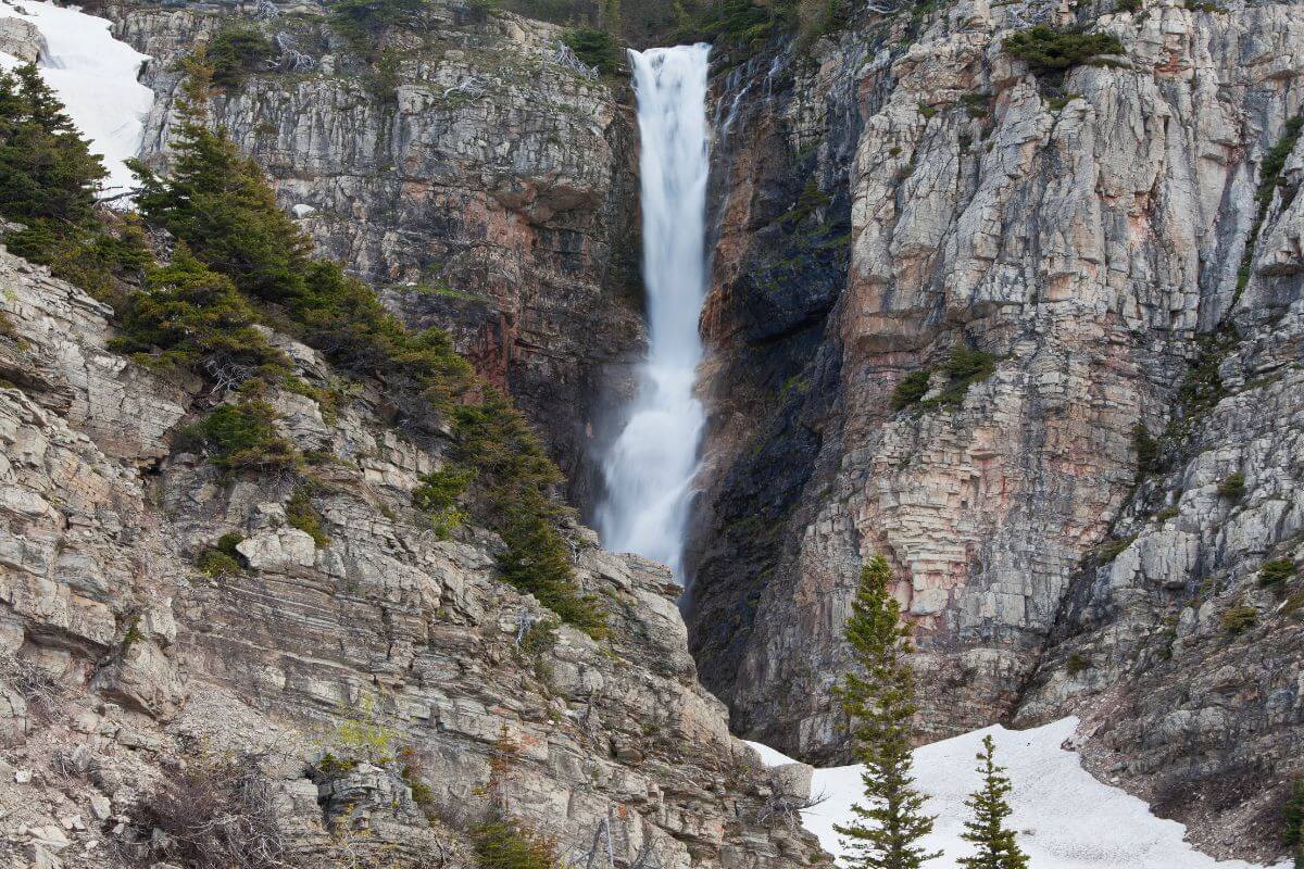 Apikuni Falls in Glacier National Park featuring a 150-foot drop