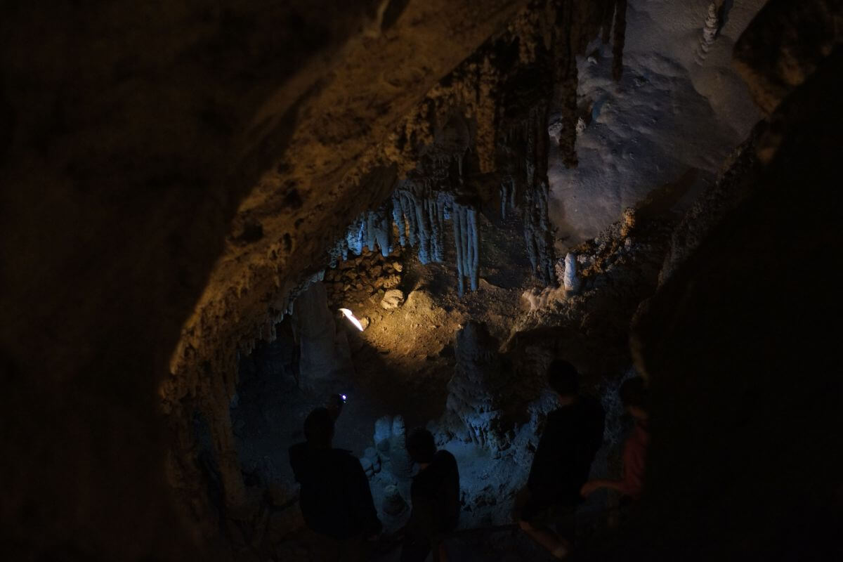 Adventurers exploring a cave in Montana.