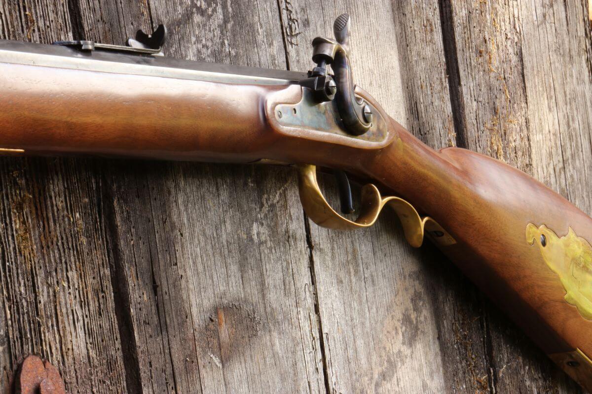 A traditional muzzleloader mounted on a wooden wall in Montana.