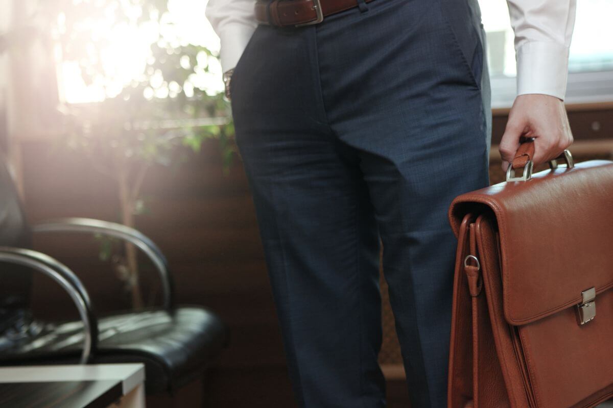 Man Holding a Leather Business Bag