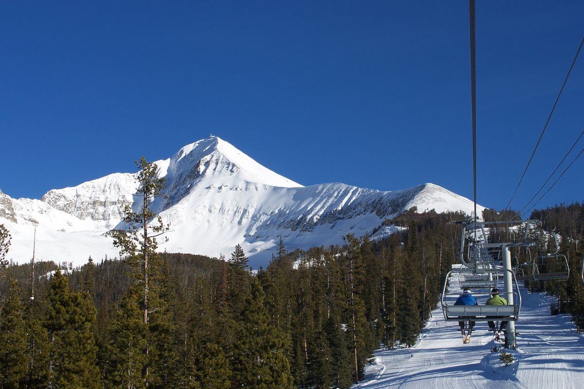 A scenic ski lift in Montana set against a mountainous backdrop.