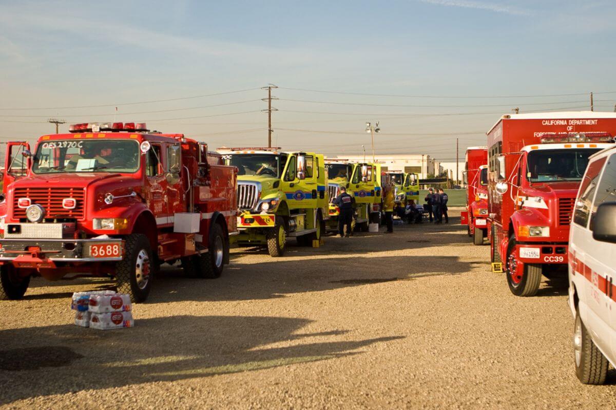 A fleet of fire trucks in a Montana parking lot.
