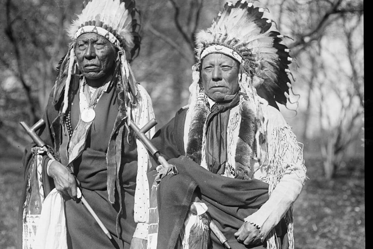Two Native Americans in Montana Wearing Headdresses