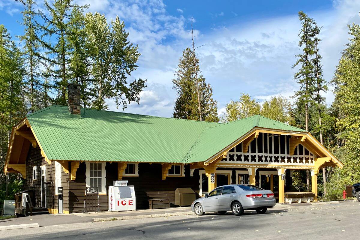 A building with a green roof and a car parked in front of it in Montana.