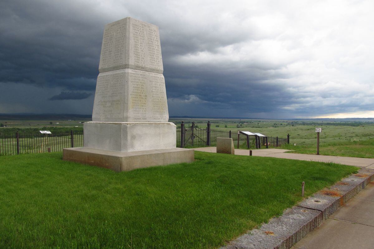A stunning monument stands tall in the middle of a serene, grassy field in Montana.