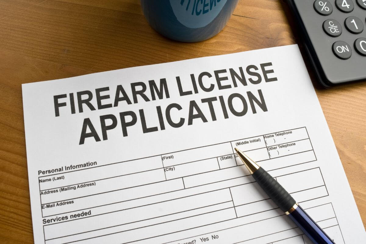 Firearm License Application Form and a Pen