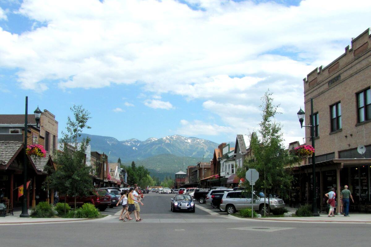 A street in a town with mountains in the background