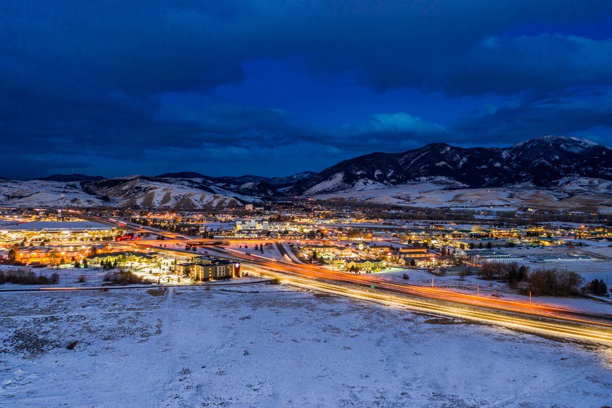 Snow-covered mountains and a quaint city in Montana