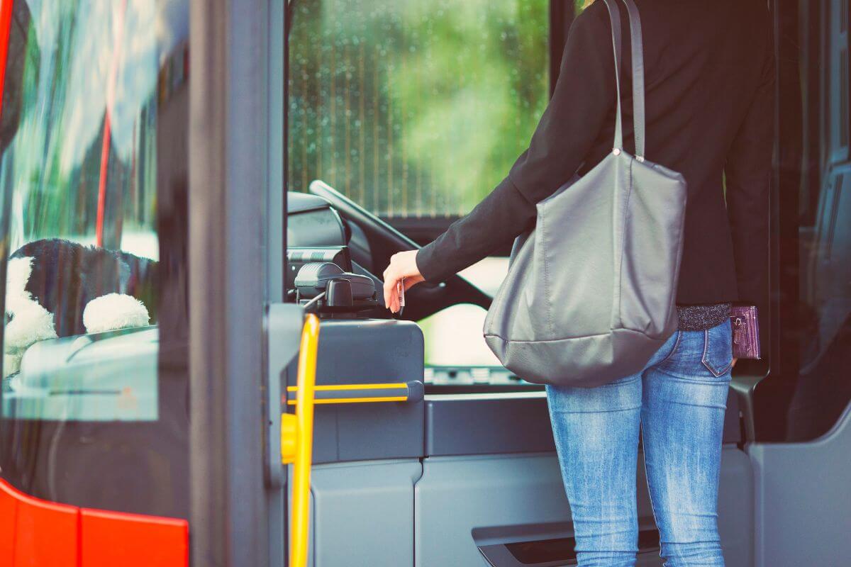 A woman swipes her card as she boards the bus in Montana.
