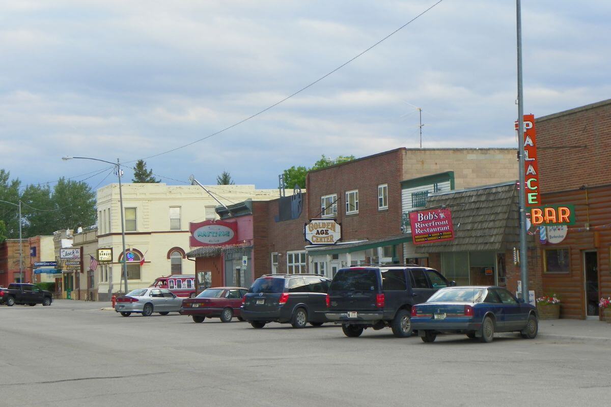 Cars parked along the street in a rural Montana town.