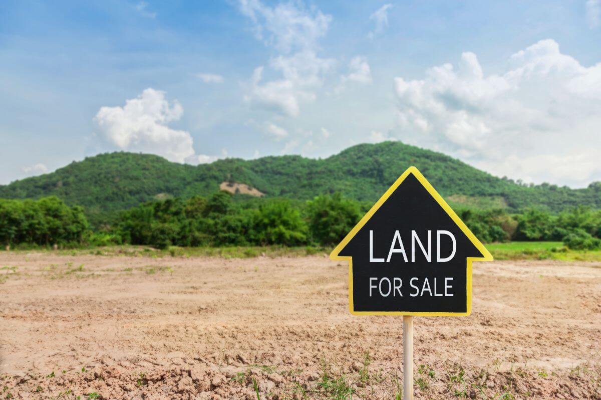 Land for sale sign in a Montana field
